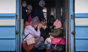 Ukrainian refugees fleeing on a train